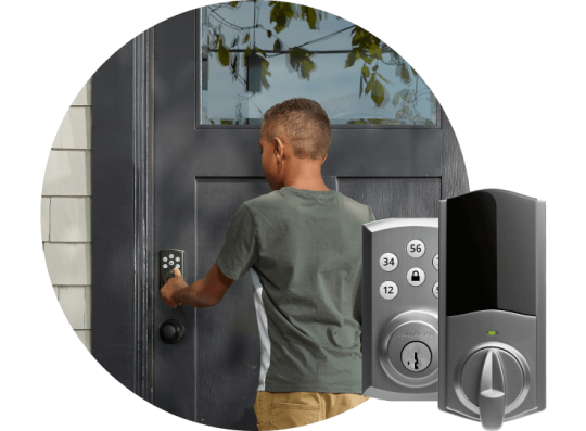 Child entering code on his front door’s smart lock.