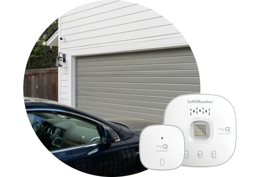 Car pulling up to a garage with garage door control