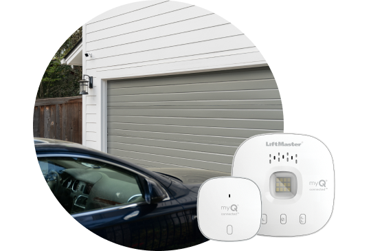 Car pulling up to a garage with garage door control