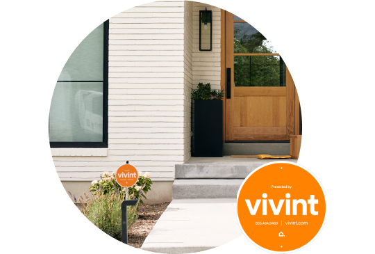 Bright orange Vivint security sign in a front yard