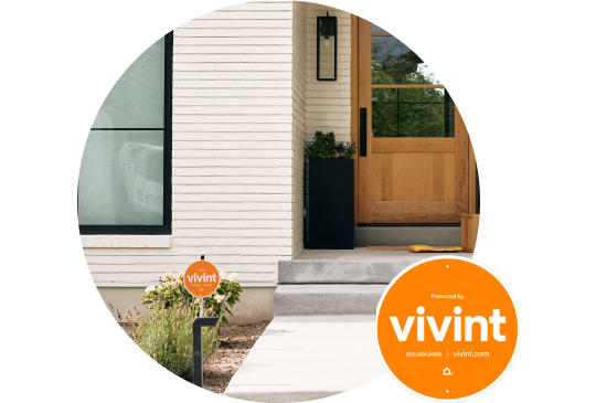Bright orange Vivint security sign in a front yard
