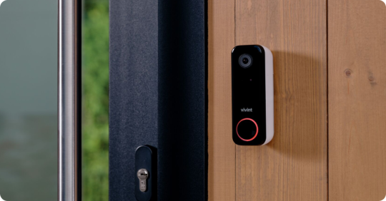 Vivint Doorbell Camera Pro mounted by a front door