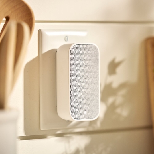 Chime Extender plugged into a tan wall