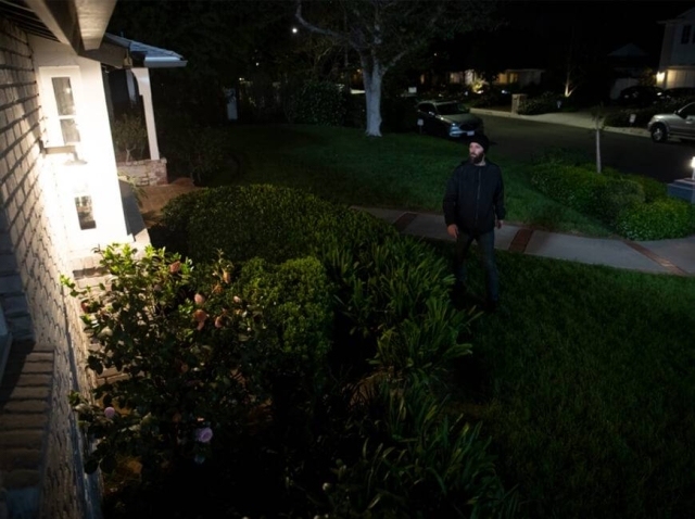 Man Outside Home at Night
