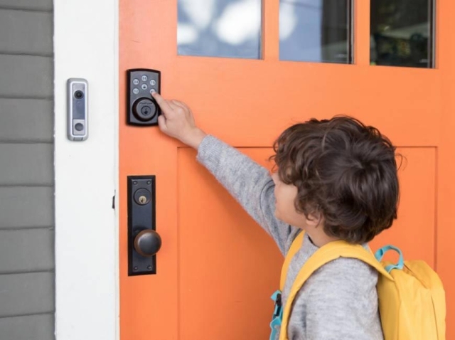 Child At Front Door Pressing Electronic Lock