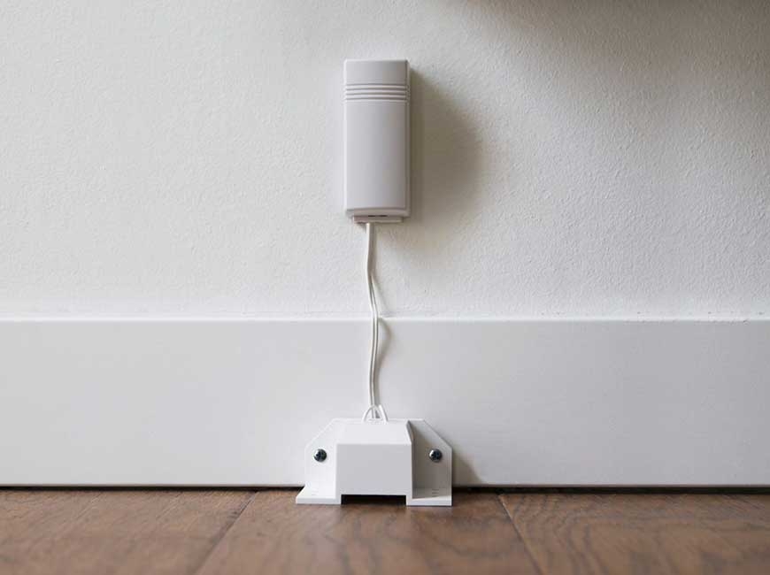 Vivint Flood Sensor on floor and wall