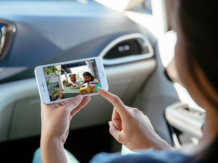 Woman in Car with App